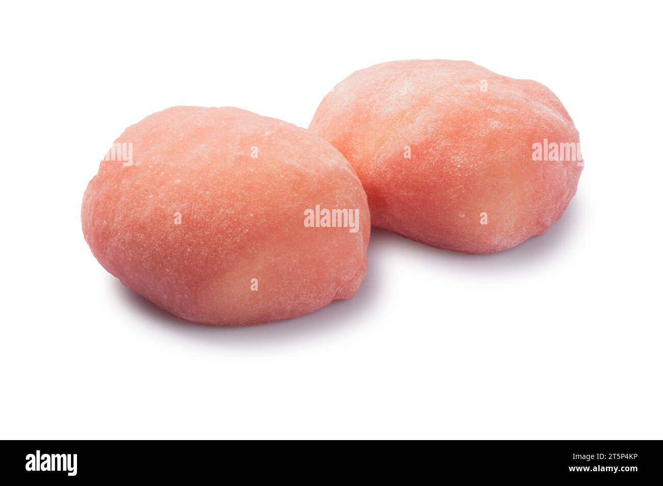 Studio shot of strawberry cheesecake style mochi cut out against a white background - John Gollop Stock Photo