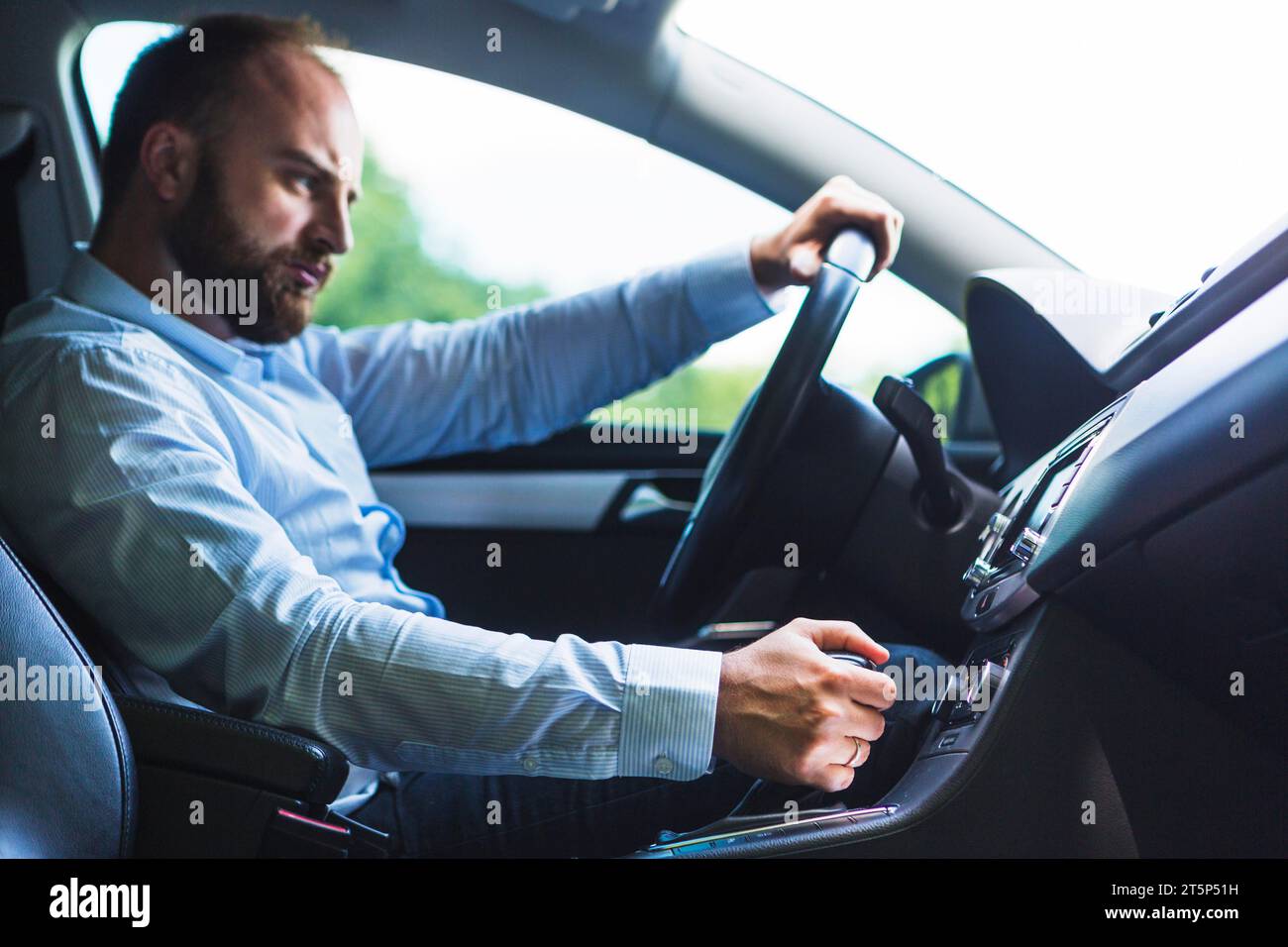 Man shifting gear stick while driving car Stock Photo Alamy