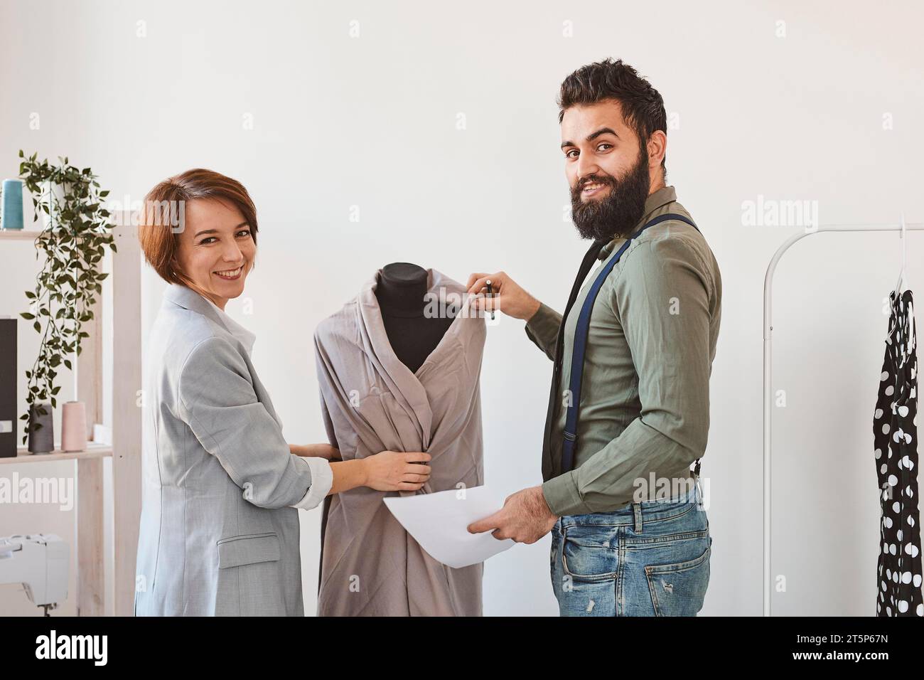 Smiley fashion designers atelier with dress form Stock Photo