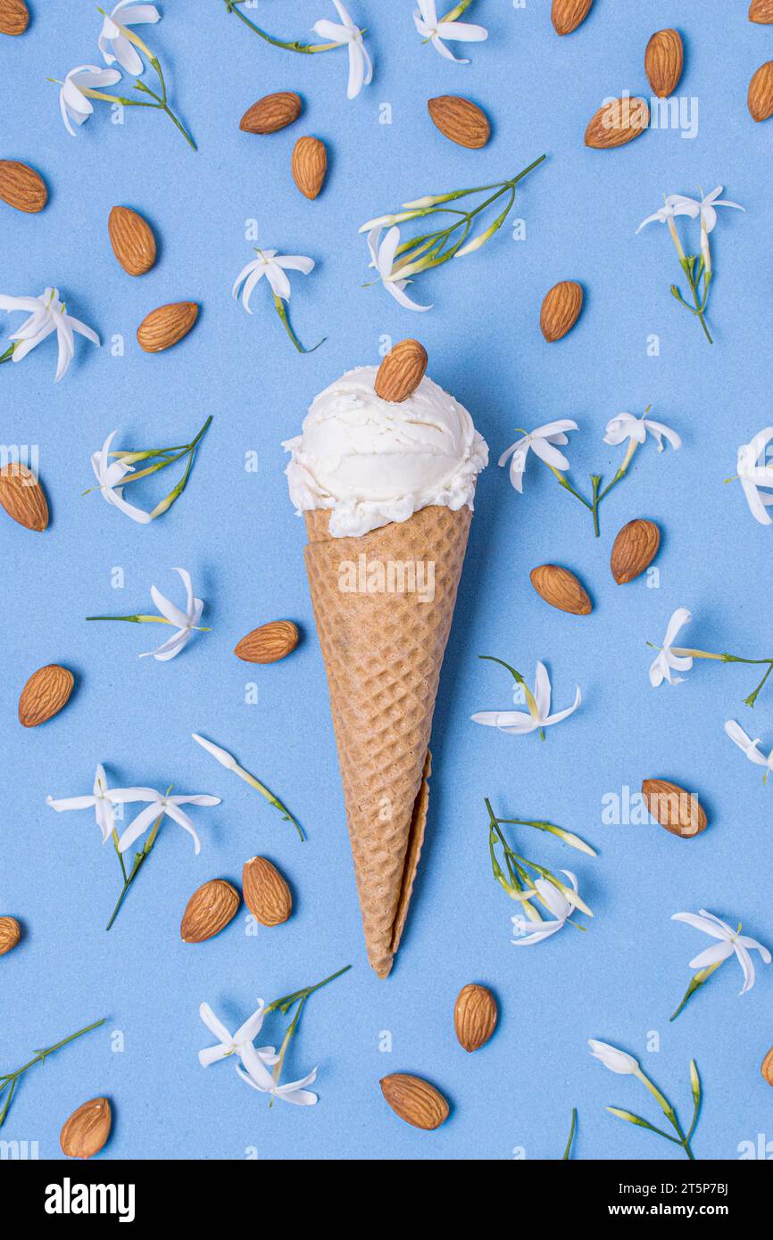 https://c8.alamy.com/comp/2T5P7BJ/almond-vanilla-ice-cream-scoop-with-cone-2T5P7BJ.jpg