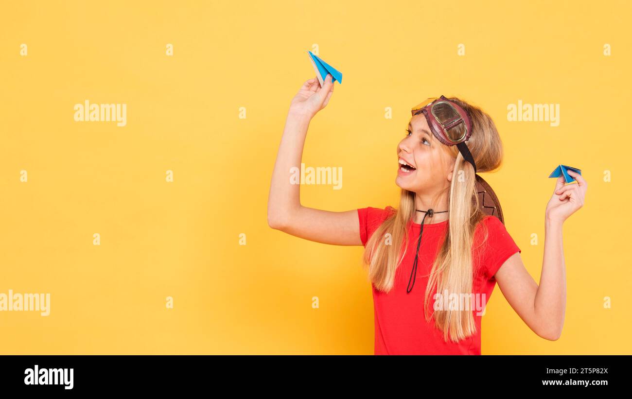 Playing With Paper Copy space girl playing with paper airplane Stock Photo - Alamy