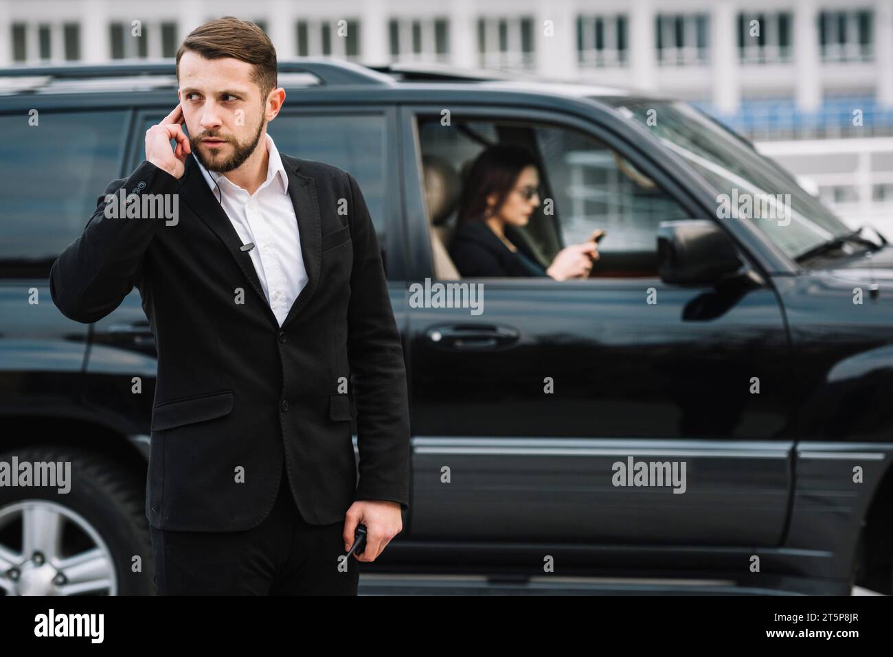 Front view security guard working Stock Photo - Alamy