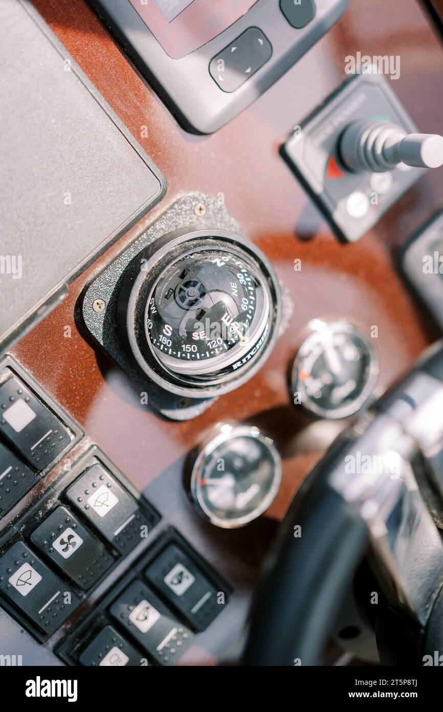 Compass near the control panel of a motor yacht. Top view Stock Photo ...