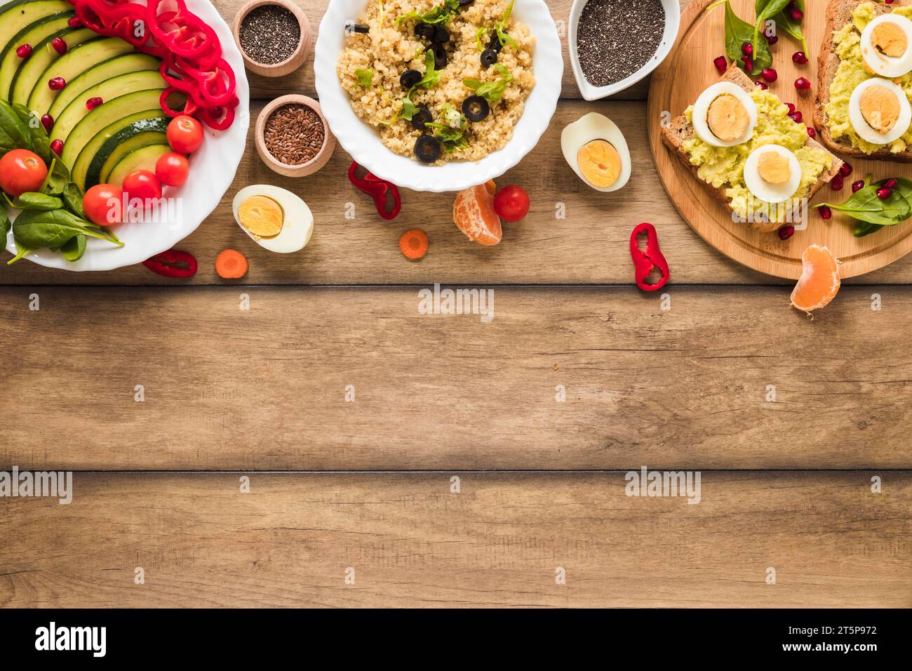 Overhead view different types healthy foods with boiled egg table Stock