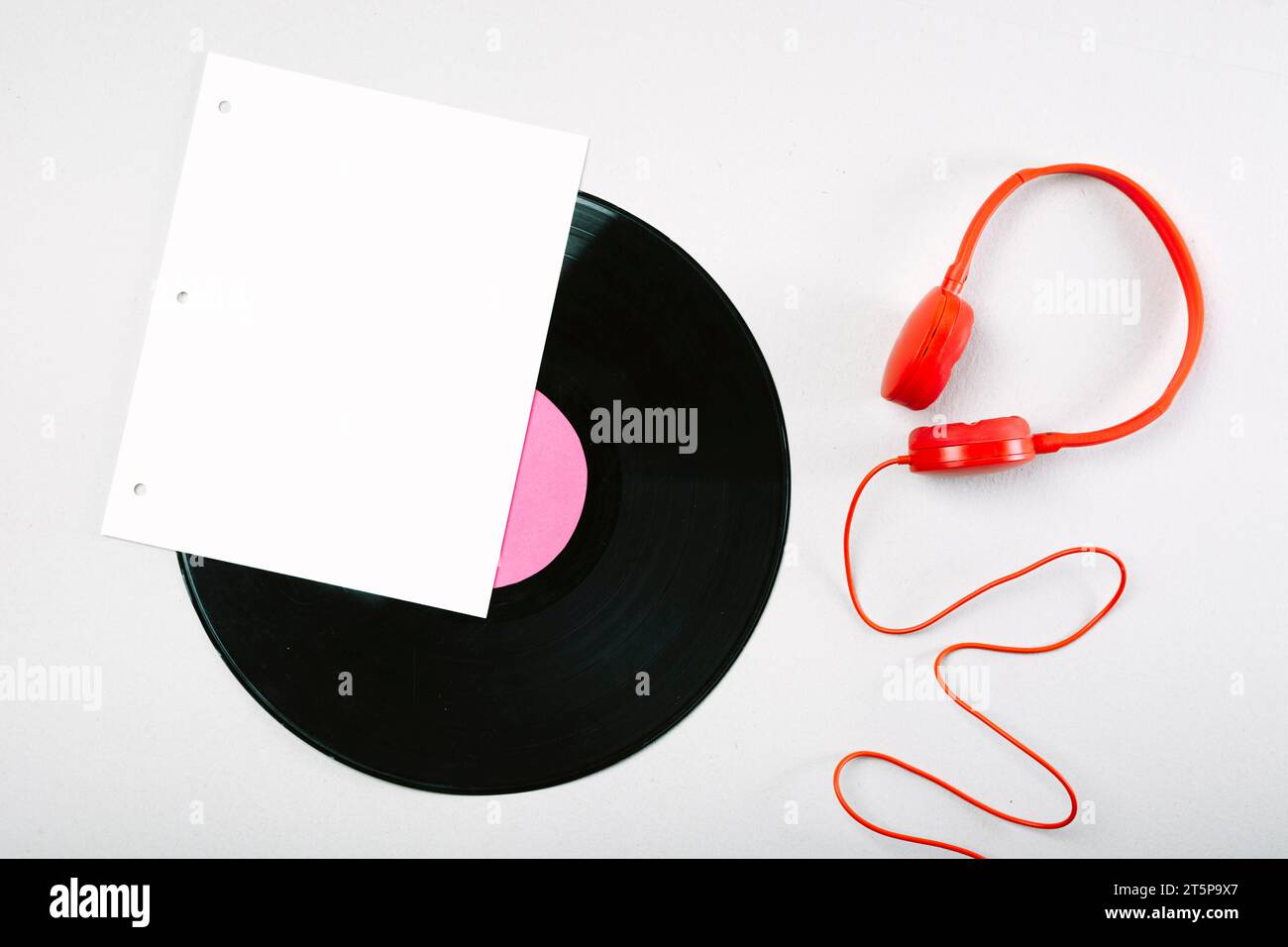 White page vinyl record red headphone white background Stock Photo