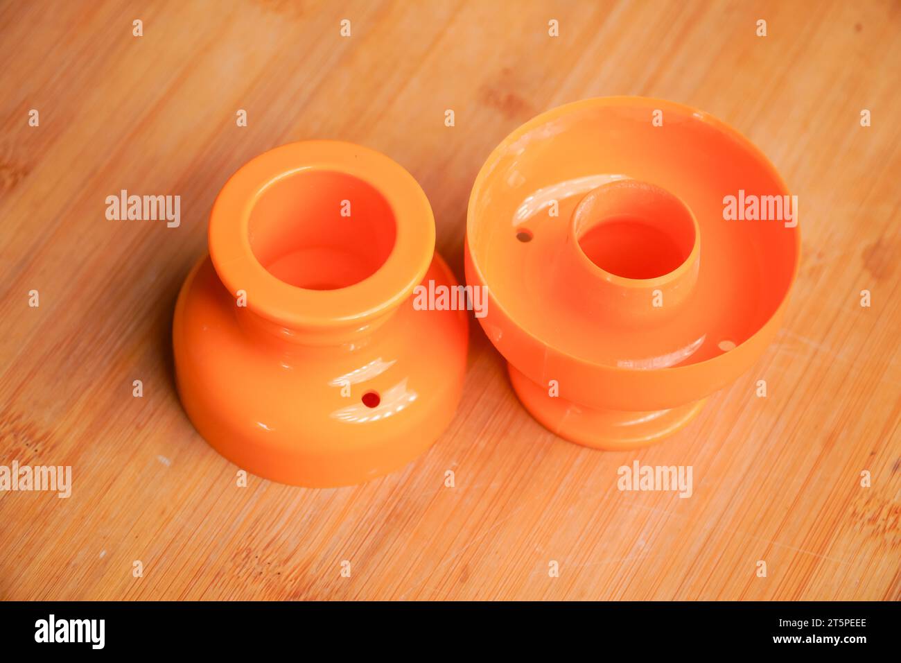 Orange round donut dough cutting tool is used to print round donuts Stock Photo