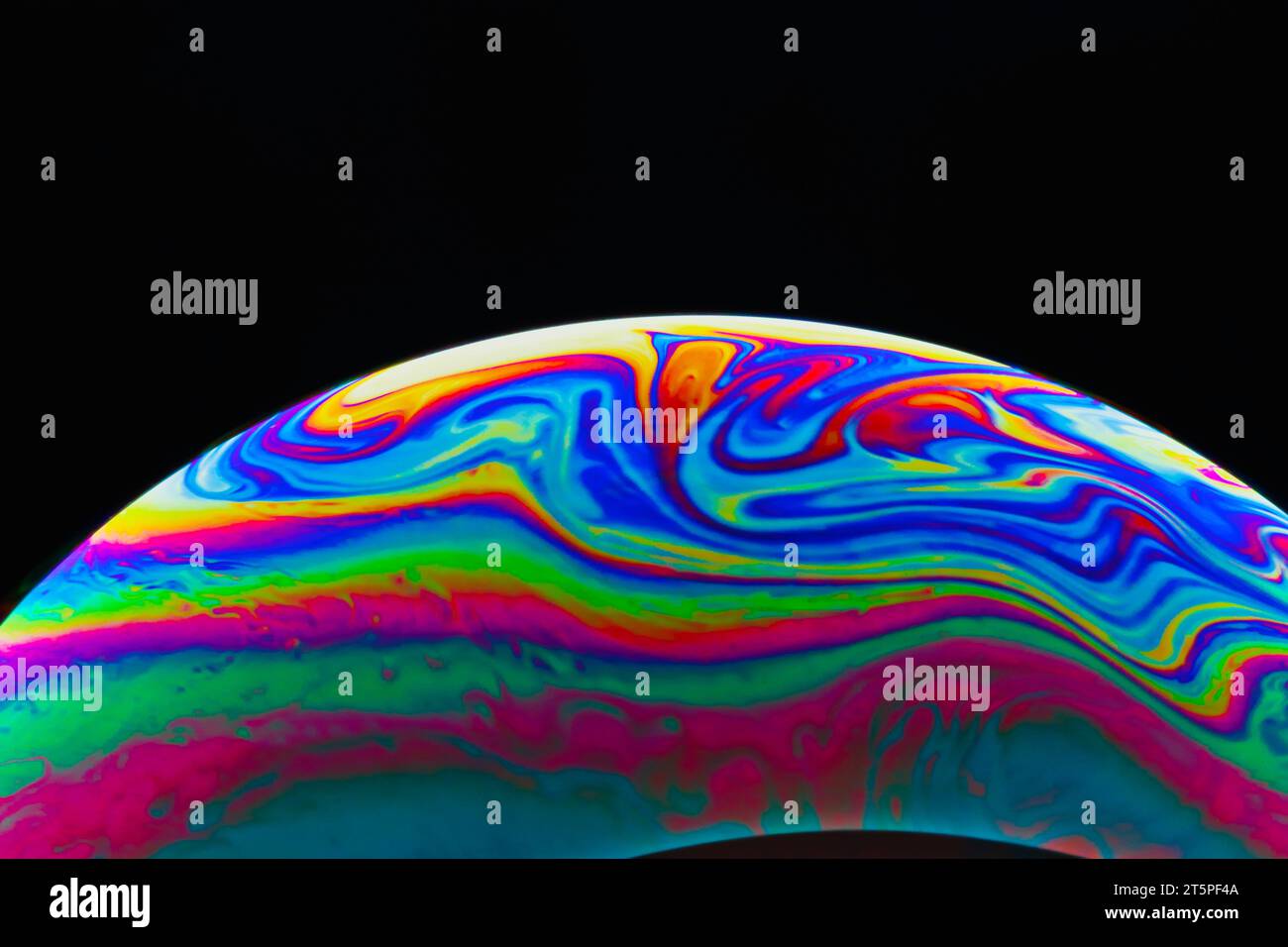 Colorful soap bubble on black background Stock Photo - Alamy