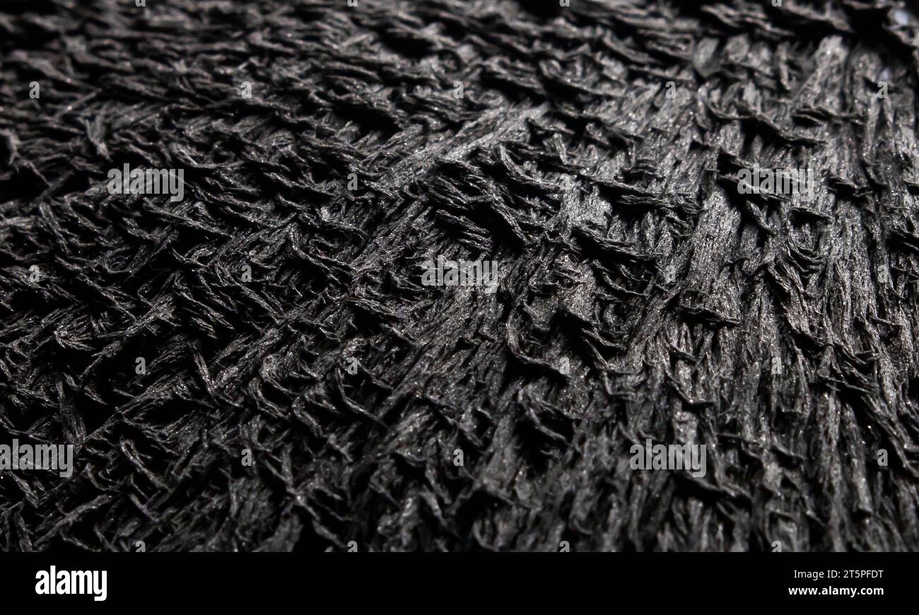 Reaction of iron dust to a strong magnet. Isolated. Visualisation of magnetic field. Iron powder spikes. Stock Photo