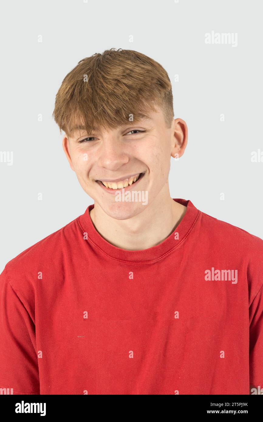 A Studio Portrait Of A Happy And Smiling Fifteen Year Old Teenage Boy a-studio-portrait-of-a-happy-and-smiling-fifteen-year-old-teenage-boy