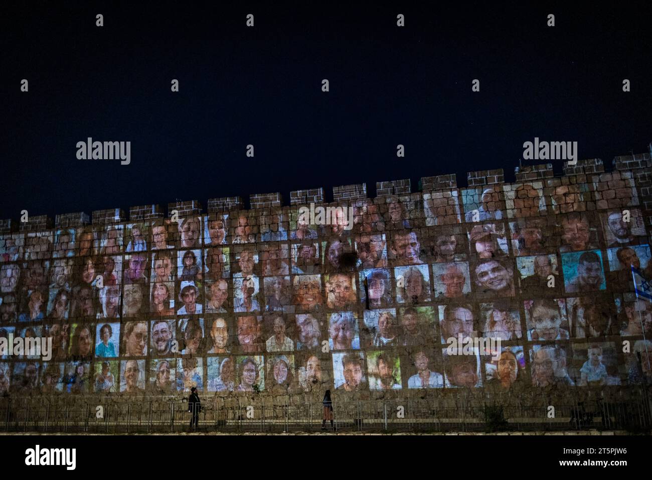 Jerusalem, Israel. 06th Nov, 2023. Photos of hostages held by Hamas are screened on the walls of The old city of Jerusalem. Credit: Ilia Yefimovich/dpa/Alamy Live News Stock Photo