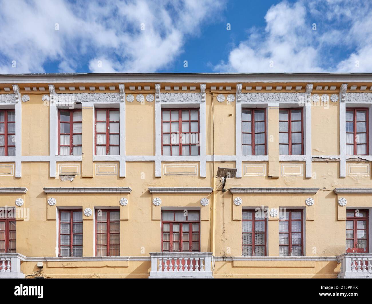 Street view of an old colonial building facade in Quito, Ecuador. Stock Photo