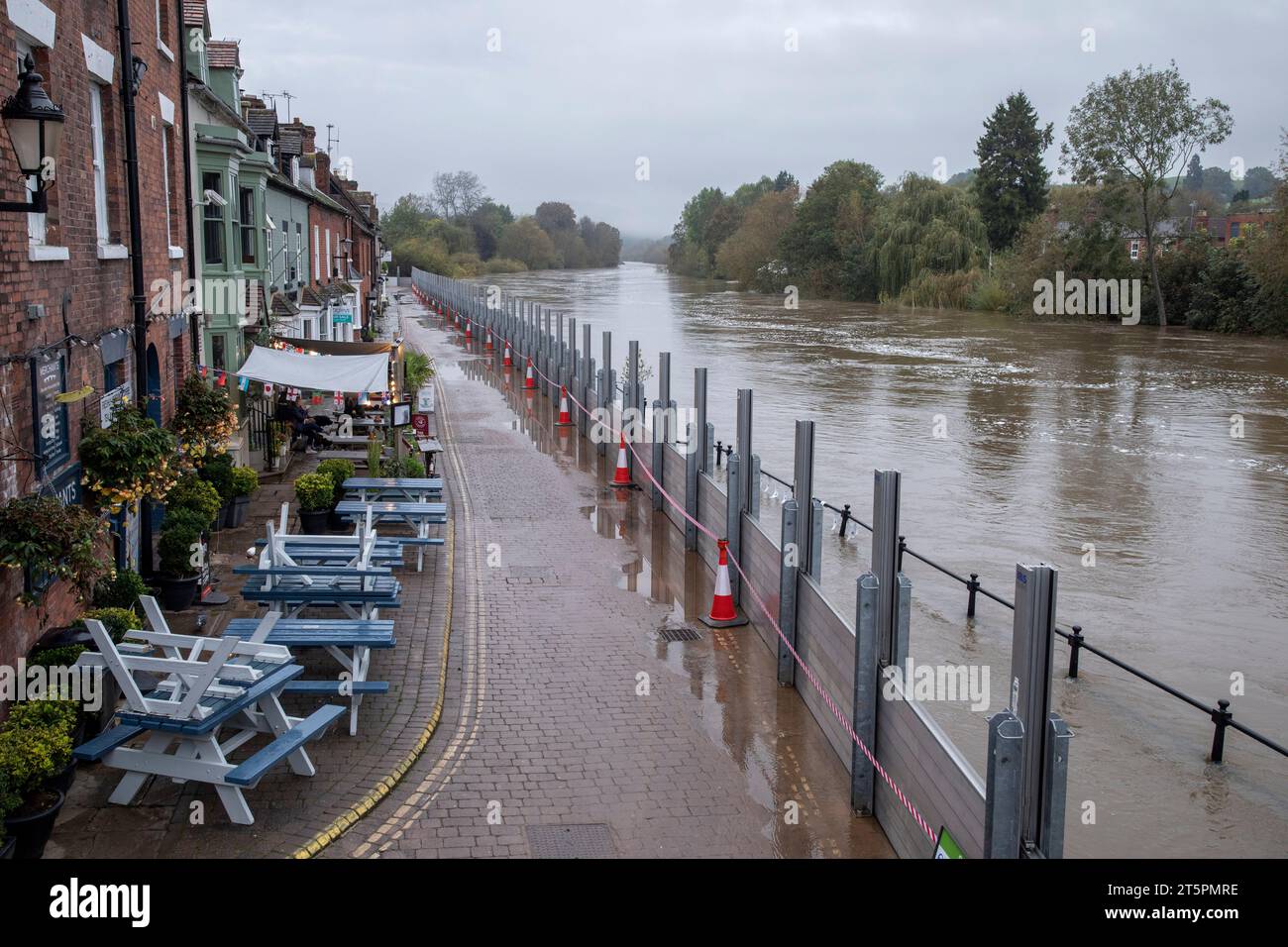 Flood barriers keep the high water level on the River Severn from flooding Severn Side North in Bewdley, Worcestershire, after Storm Babet. Stock Photo