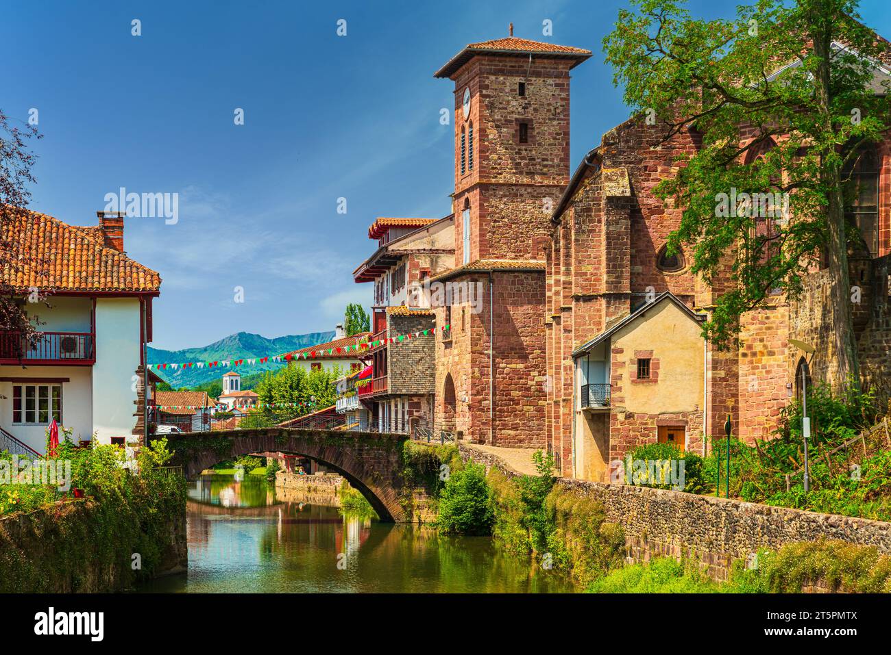 Scenic view of a picturesque French town crossed by a tranquil river. Saint-Jean-Pied-de-Port, France Stock Photo