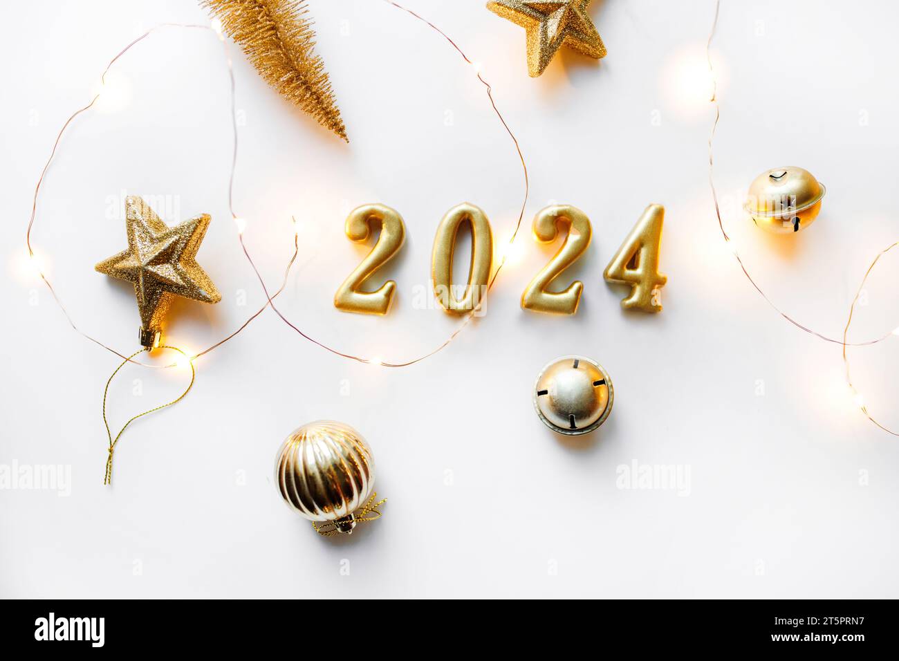 year 2024 golden symbol. Happy New Year 2024 poster. Christmas background with gold 2024 numbers. Stock Photo