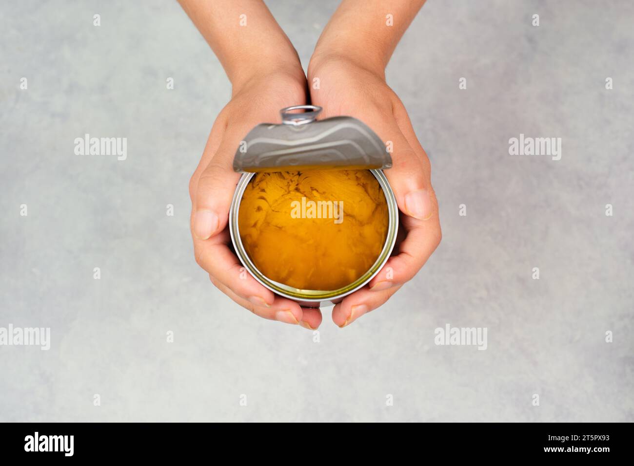 Open tin can with preserved food, box with tuna fish, processed
