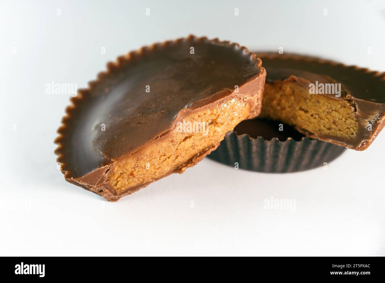 Macro shot of Peanut butter filled candy with chocolate frosting isolated on white background Stock Photo