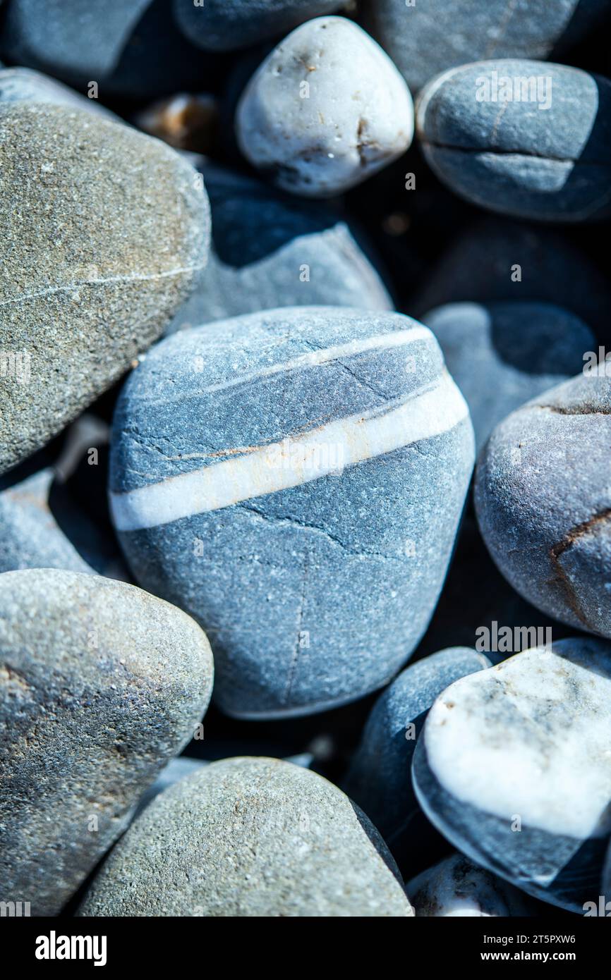 Close up of stones and pebbles on a beach in Cornwall, England, UK Stock Photo