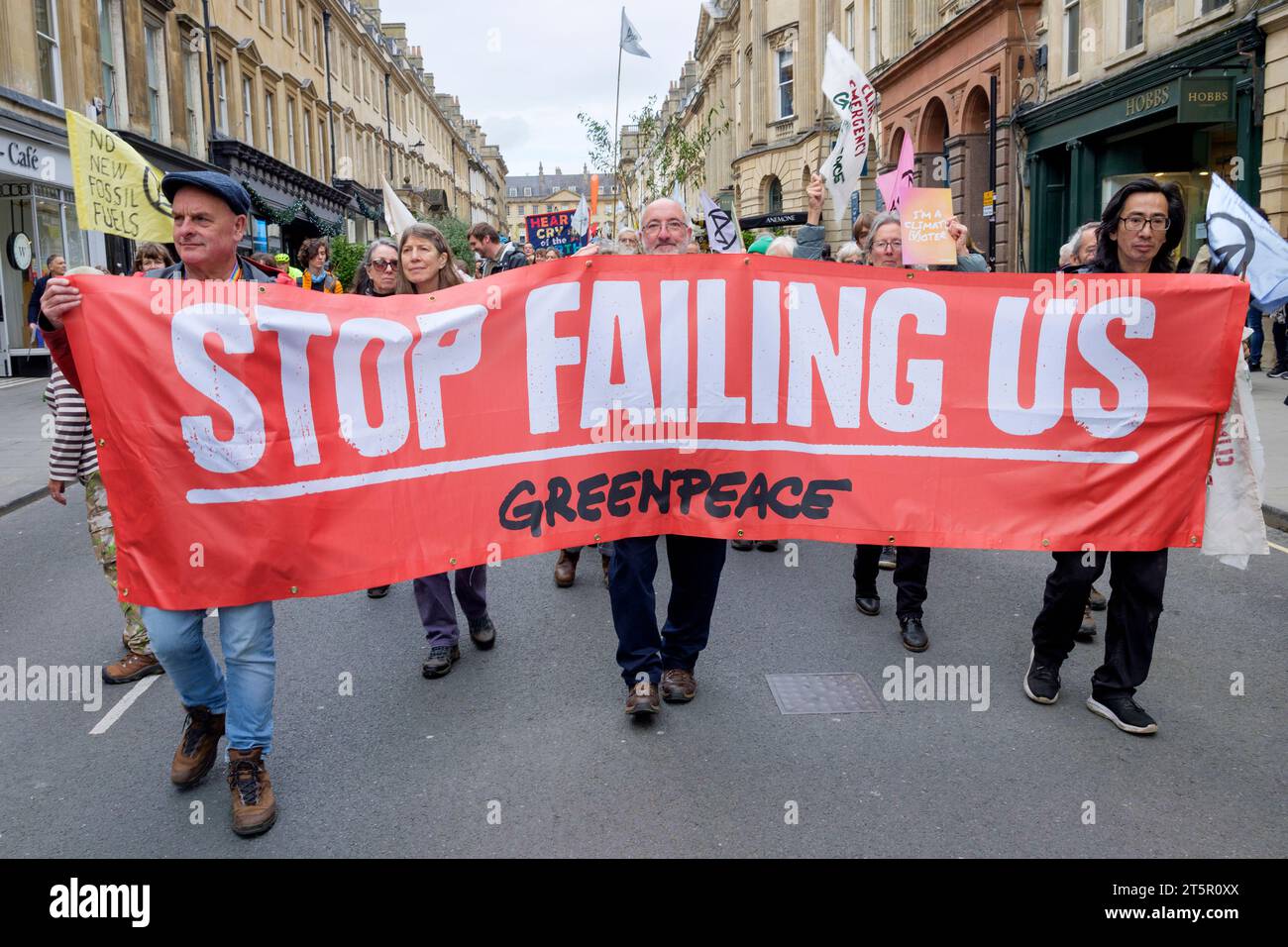 Bath, UK. 28th Oct, 2023. Climate-change campaigners protesters are pictured as they take part in a protest march through Bath city centre. Stock Photo