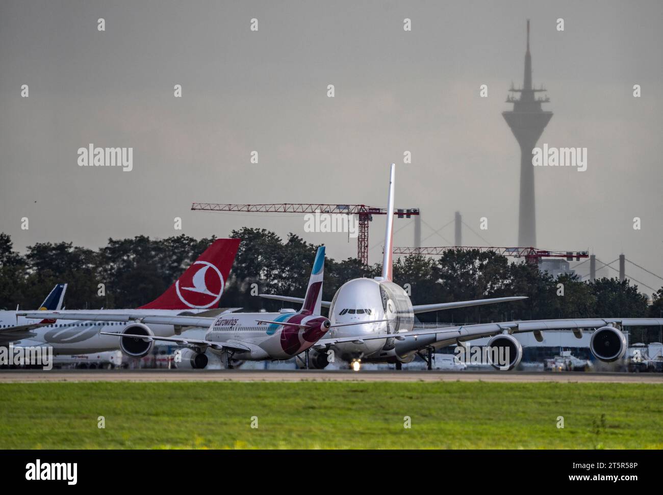 Düsseldorf International Airport, Emirates, Airbus A380-800, A6-EUT,on the taxiway for take-off, Rhine Tower, Stock Photo