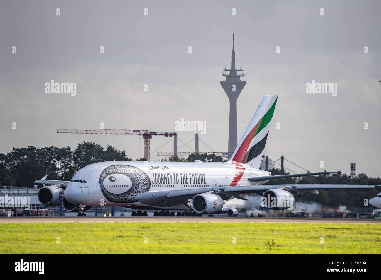 Düsseldorf International Airport, Emirates, Airbus A380-800, A6-EUT,on the taxiway for take-off, Rhine Tower, Stock Photo