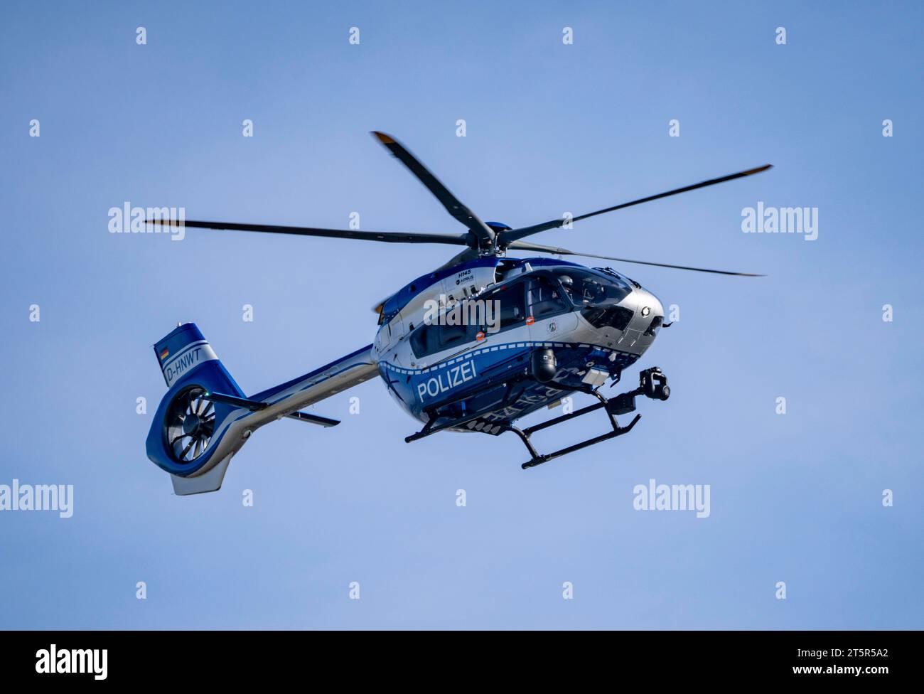 Police helicopter, Airbus Helicopters H145, of the NRW state police, after take-off at Düsseldorf Airport, police aviation squadron, Stock Photo