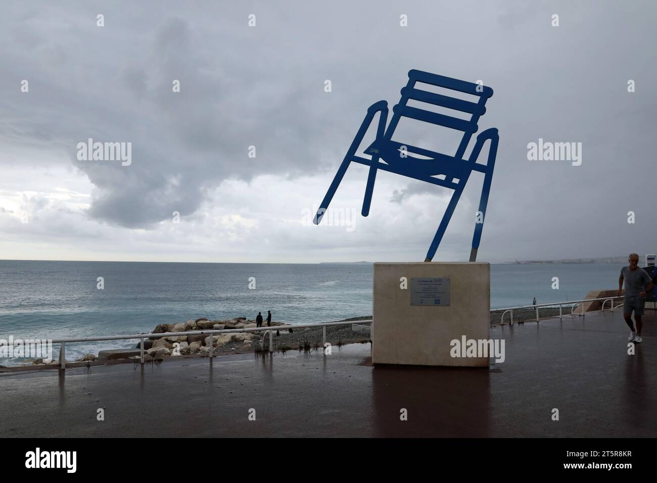 The Blue Chair by Sabine Geraudie at a cloudy Nice in the South of France Stock Photo