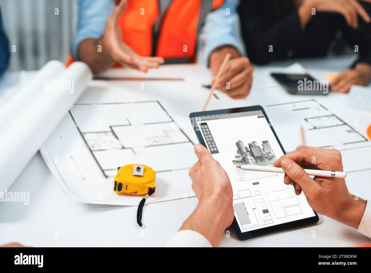 Diverse group of civil engineer and client working together on ...