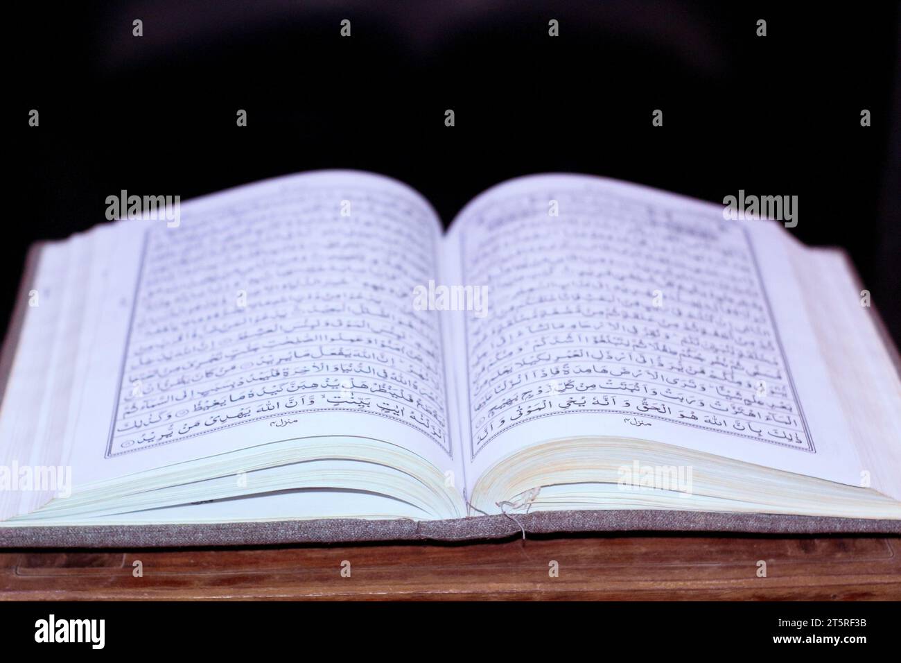 Holy book quran open on verses surah al hajj Stock Photo