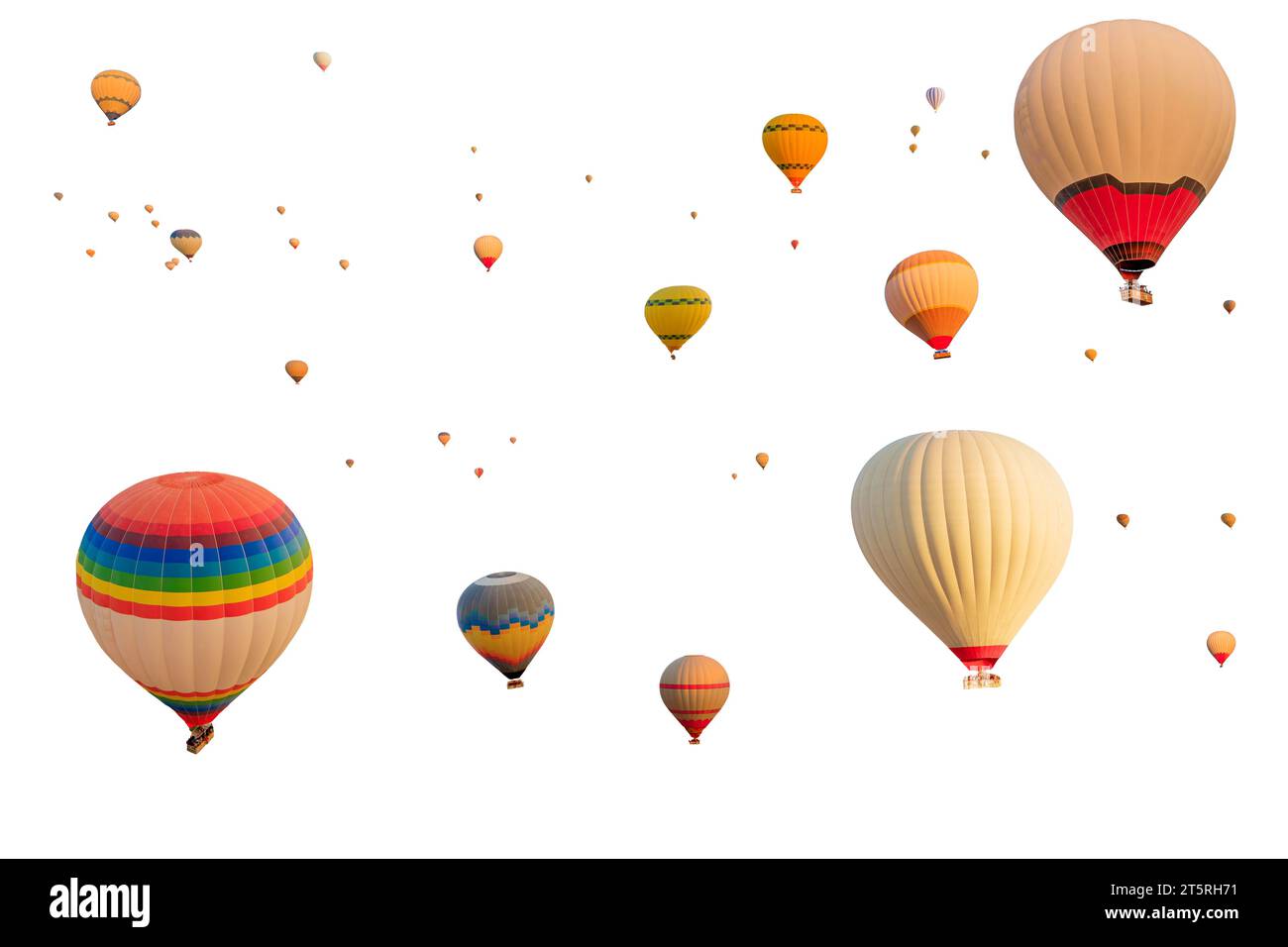 hot air balloons flying on white background. Against pure white backdrop, colorful balloons as if they have escaped from of storybook, with vivid Stock Photo