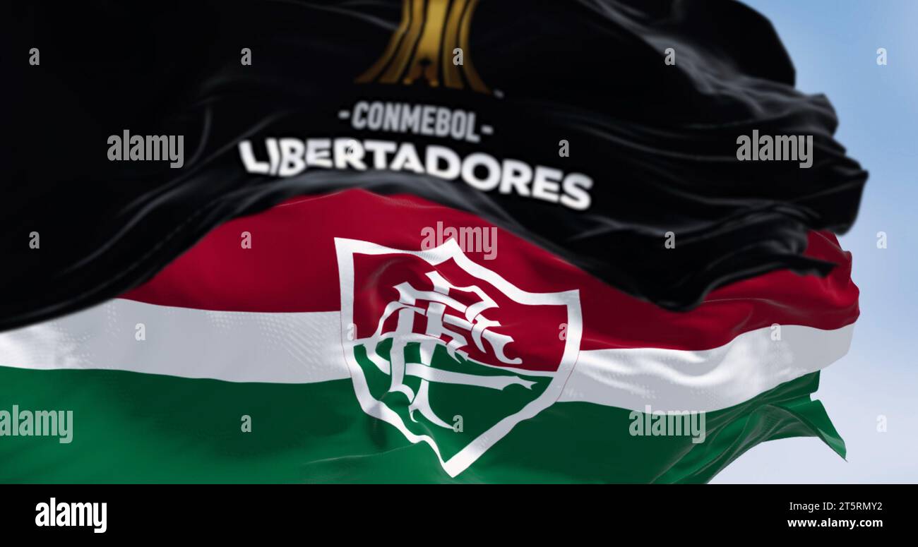 Rio de Janiero, BR, Nov. 4 2023: The CONCACAF Libertadores Cup and Fluminense flags flying together. The Brazilian team won the 2023 edition. Stock Photo