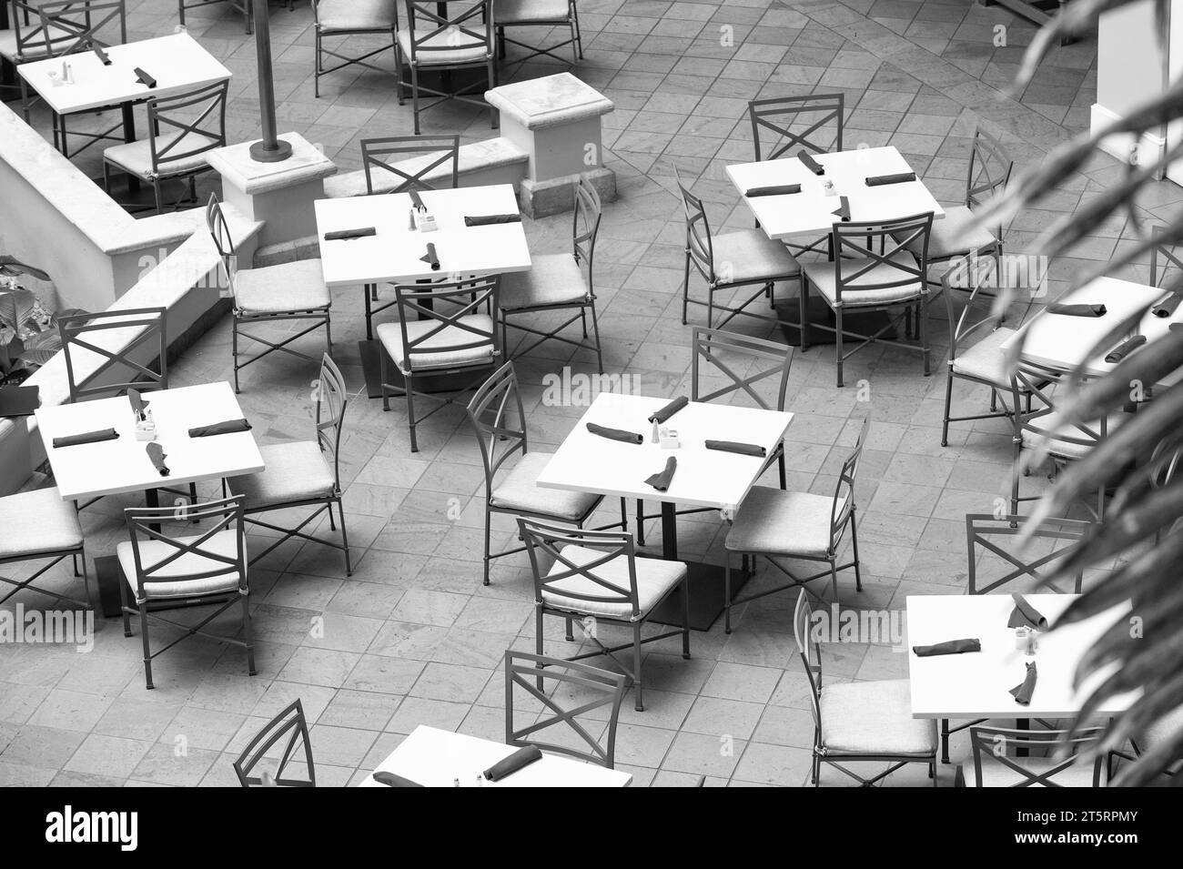 Empty outdoor cafe or restarant. Cafe restaurant furniture set in patio terrace backyard Stock Photo