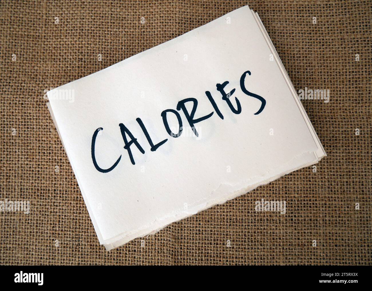 Calories are written on card paper. Calorie counting concept Stock