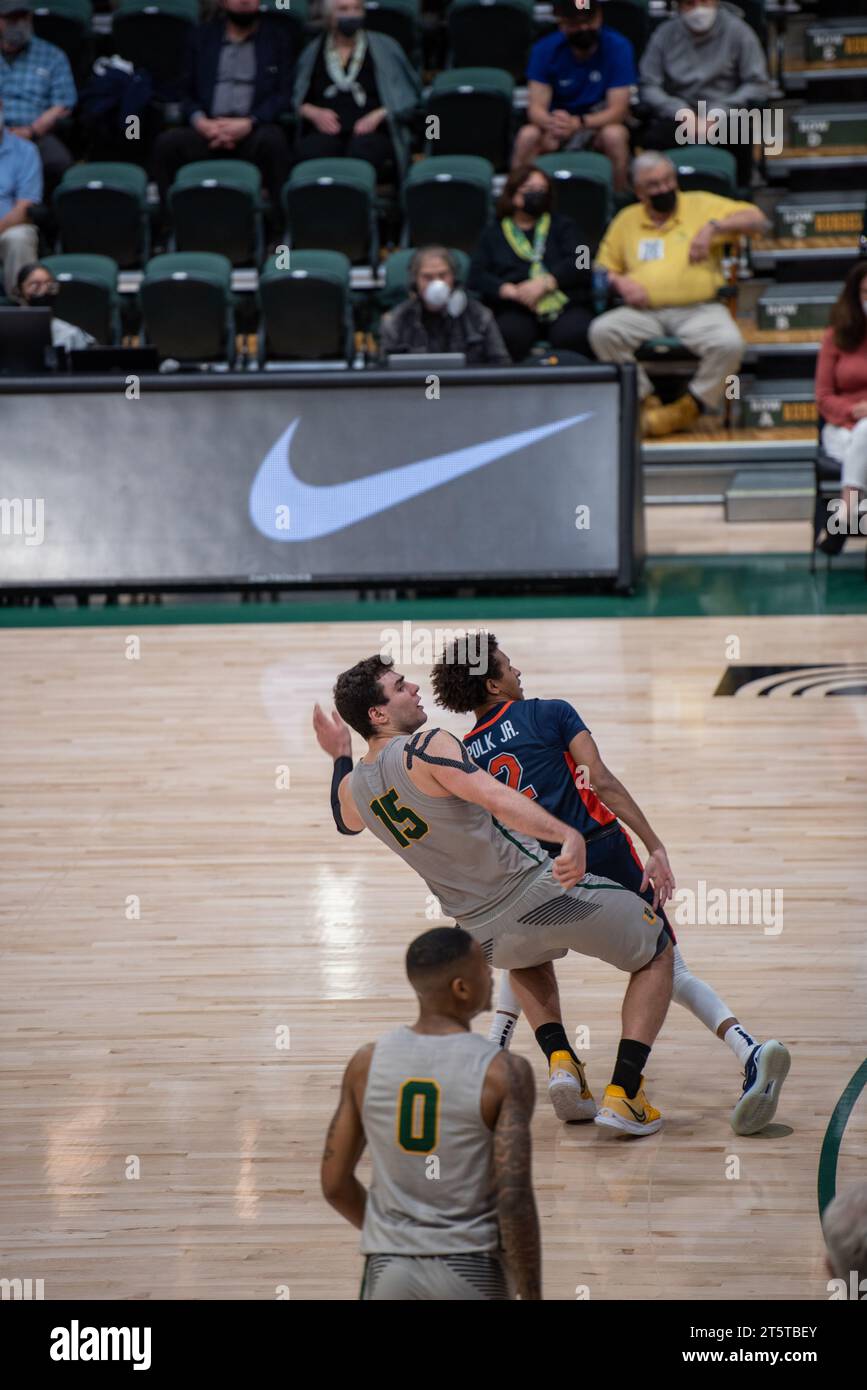 College Basketball player Shooting a made shot Stock Photo