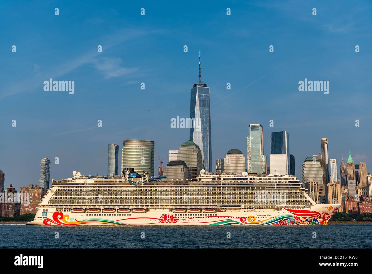 New York, USA - June 13, 2023: Cruise ship Norwegian Joy Sailing next to Manhattan in New York. Skyline of New York Manhattan cruising on the Hudson R Stock Photo