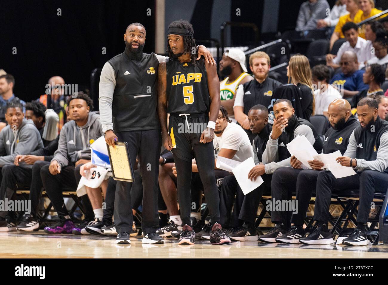 ArkansasPine Bluff head coach Solomon Bozeman, left, talks with Rashad