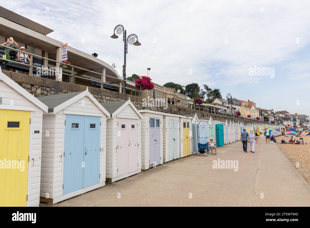 Lyme Regis Dorset, traditional English seafront beach huts painted in