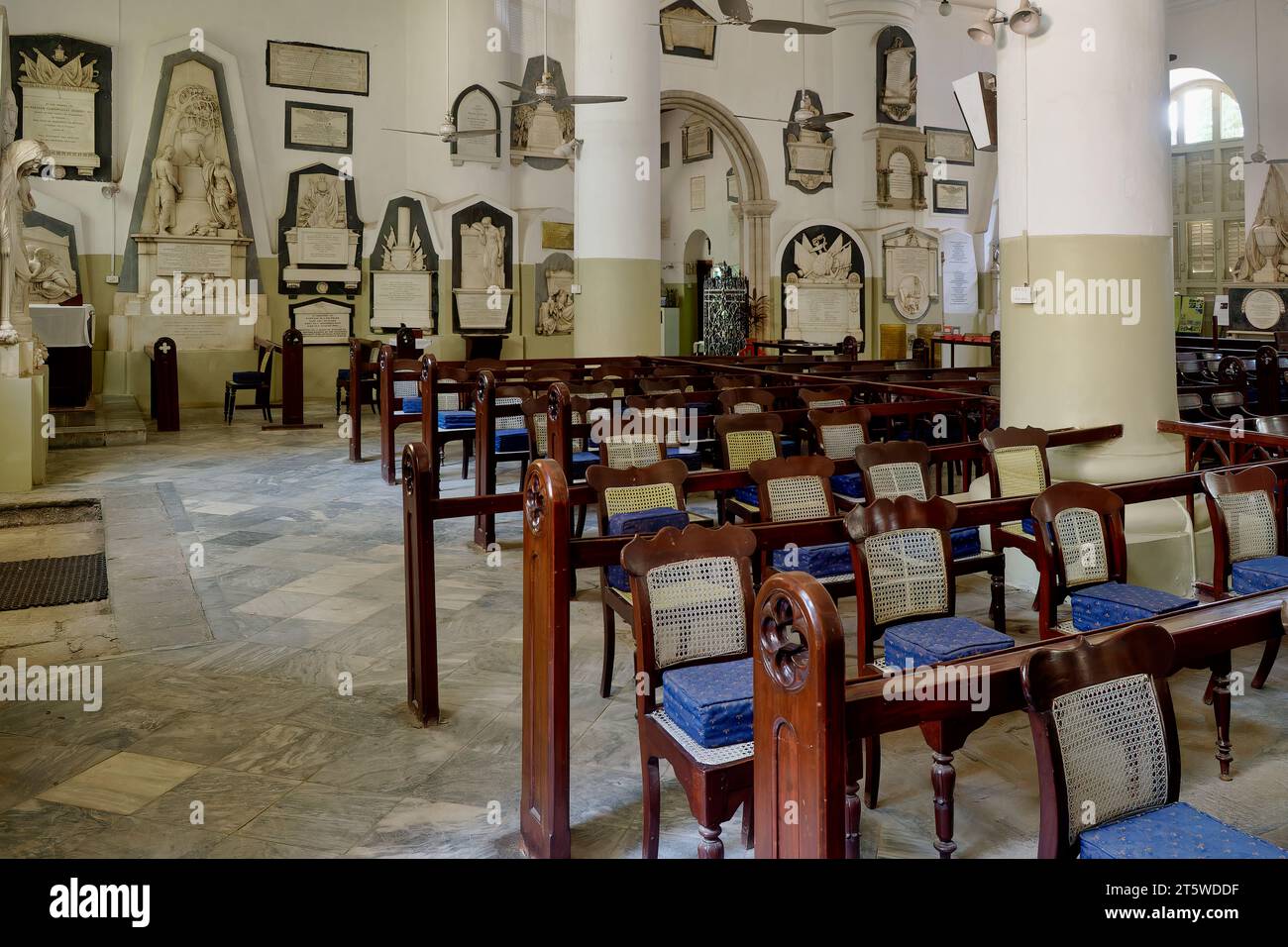 Inside St. Thomas' Cathedral in Fort area, Mumbai, India, with colonial era memorials and memorial plaques to colonial officers along the walls Stock Photo