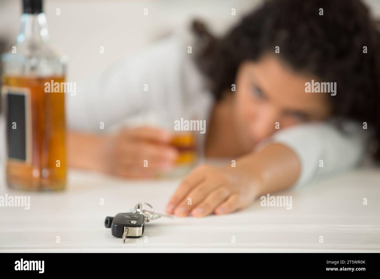 a woman driver and alcoholism problem Stock Photo