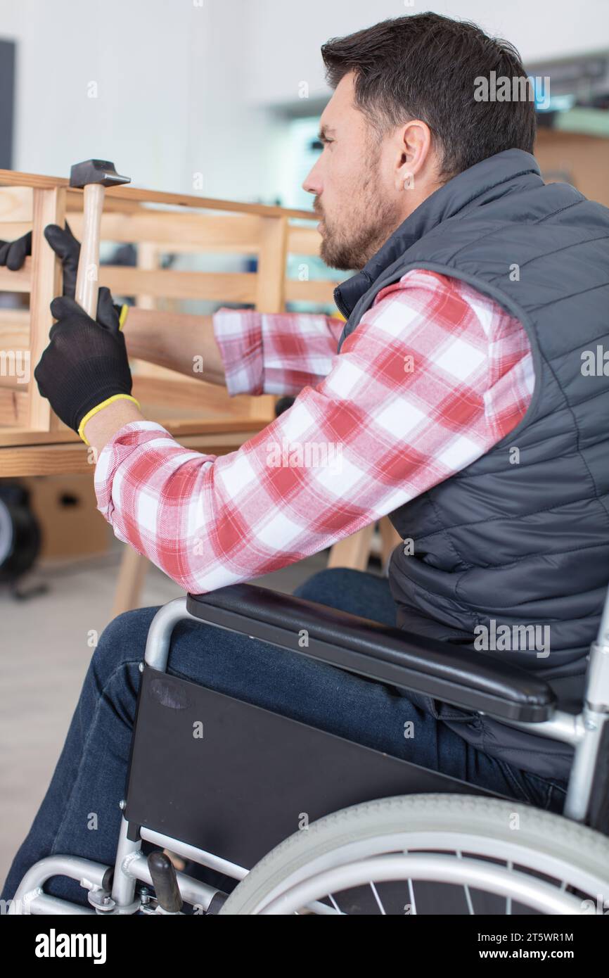 male carpenter in a wheelchair Stock Photo Alamy