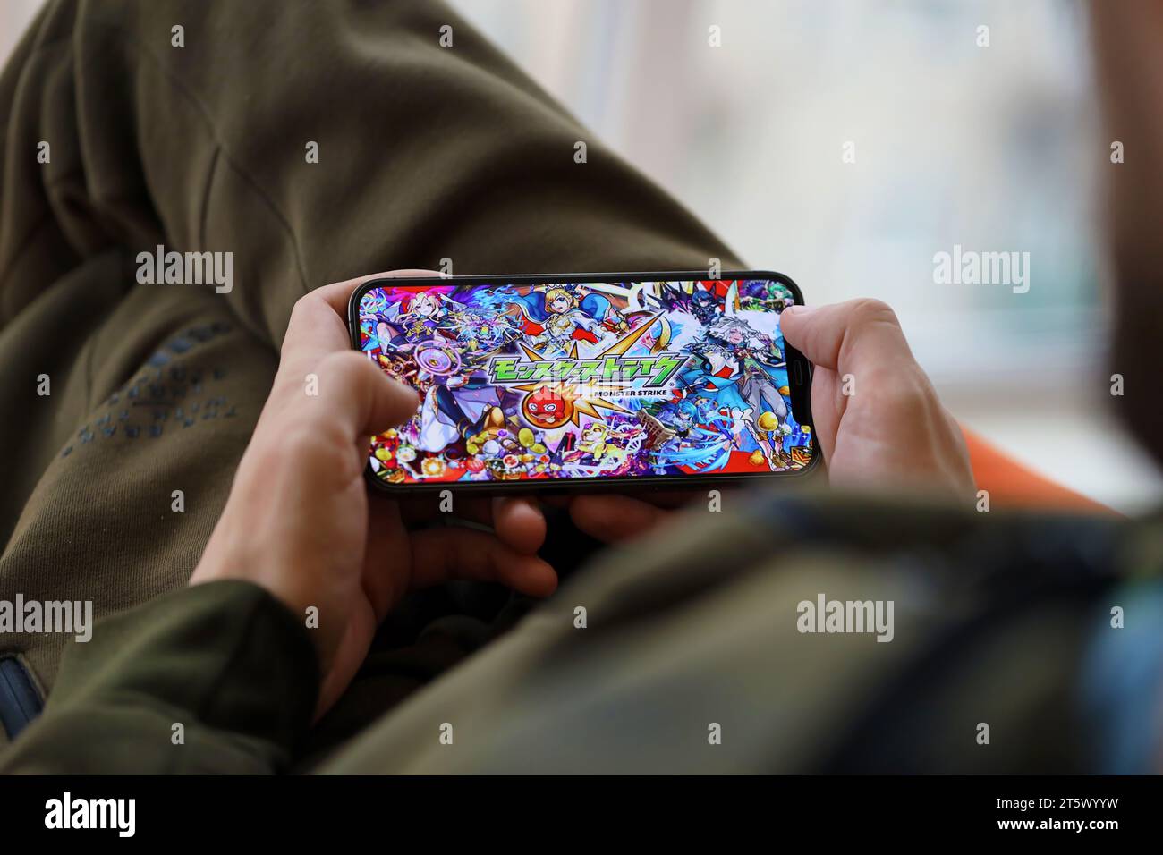 Monster Strike mobile iOS game on iPhone 15 smartphone screen in male hands  during mobile gameplay. Mobile gaming and entertainment on portable device  Stock Photo - Alamy