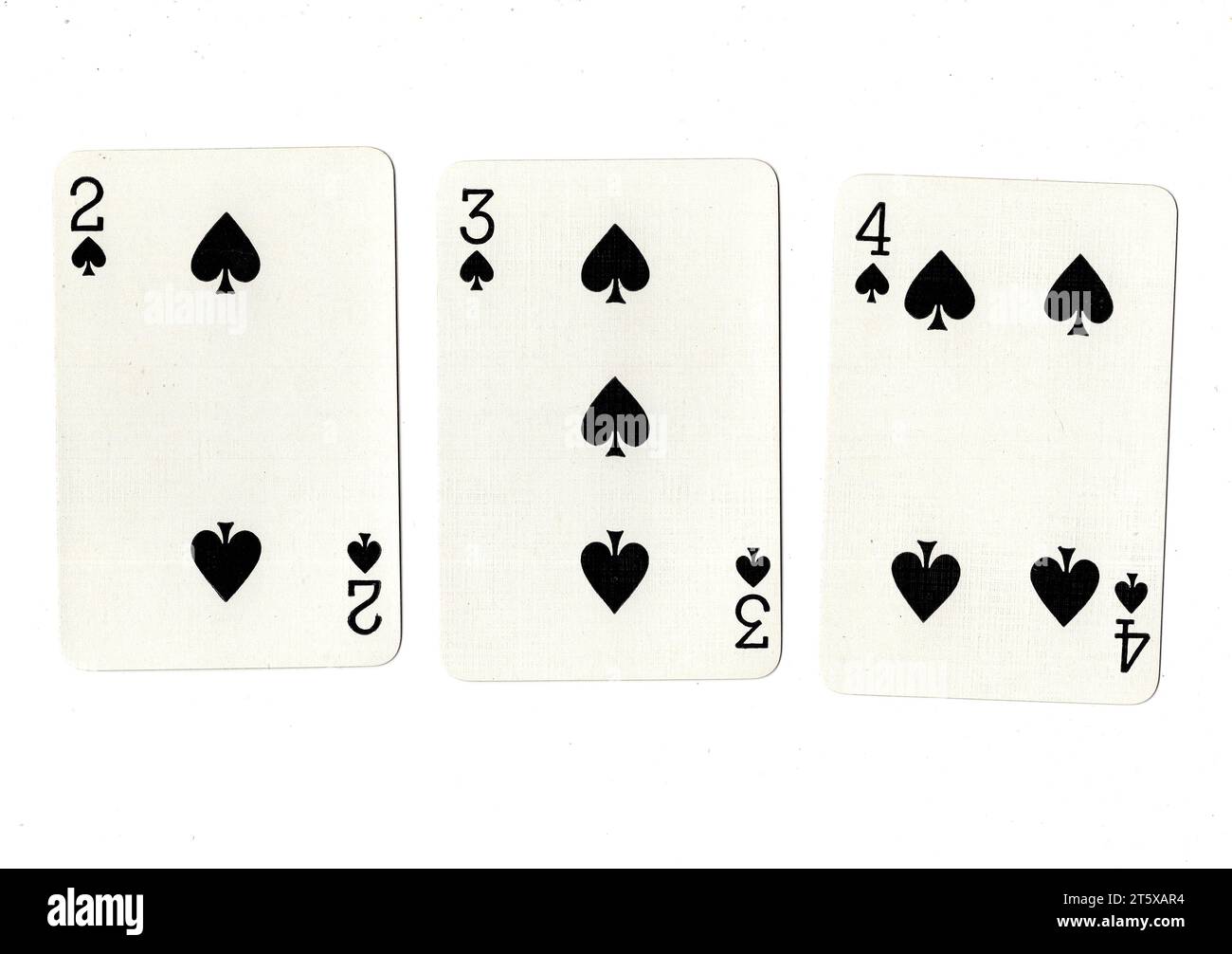 Spades Rundown A selection of three vintage playing cards showing a run of two, three ...