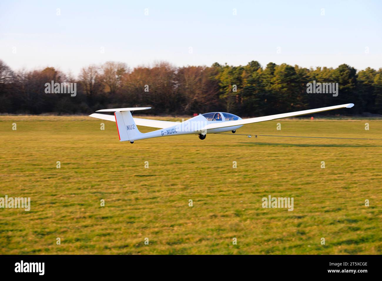 Grob 103 Acro glider of the University of Nottingham Gliding Club on winch launch take off from RAF Cranwell, Lincolnshire. Stock Photo