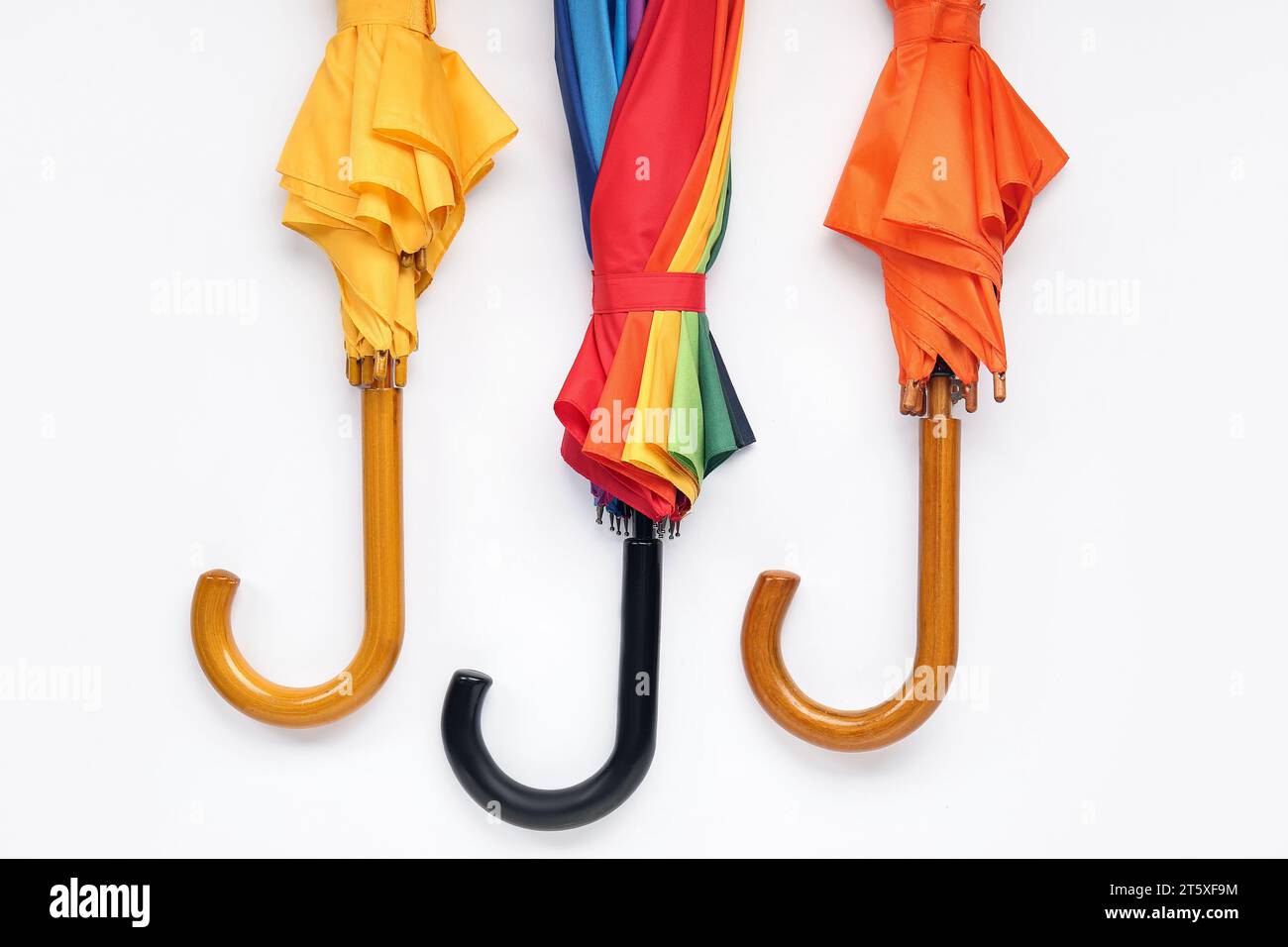 Different stylish umbrellas on white background Stock Photo