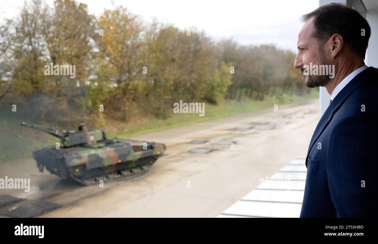 Munich, Germany. 07th Nov, 2023. Haakon, Crown Prince of Norway, watches a performance demonstration of a Puma infantry fighting vehicle on the Krauss-Maffei Wegmann GmbH tank test track. The Norwegian Crown Prince has come to Germany for a four-day visit. Credit: Sven Hoppe/dpa/Alamy Live News Stock Photo