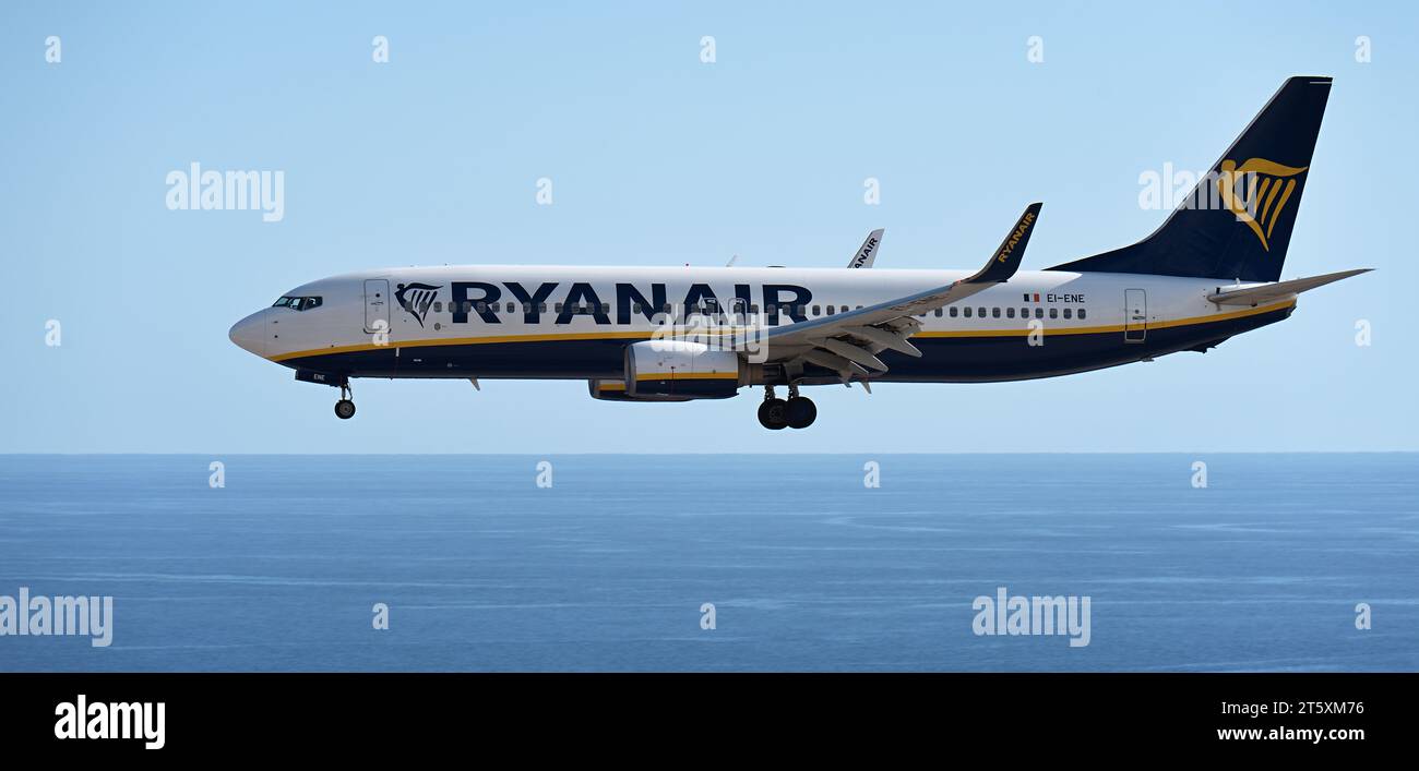 Tenerife, Spain November 5 st, 2023. Boeing 737-8AS of Ryanair Airlines flies in the blue sky, landing at Tenerife Airport over the ocean Stock Photo