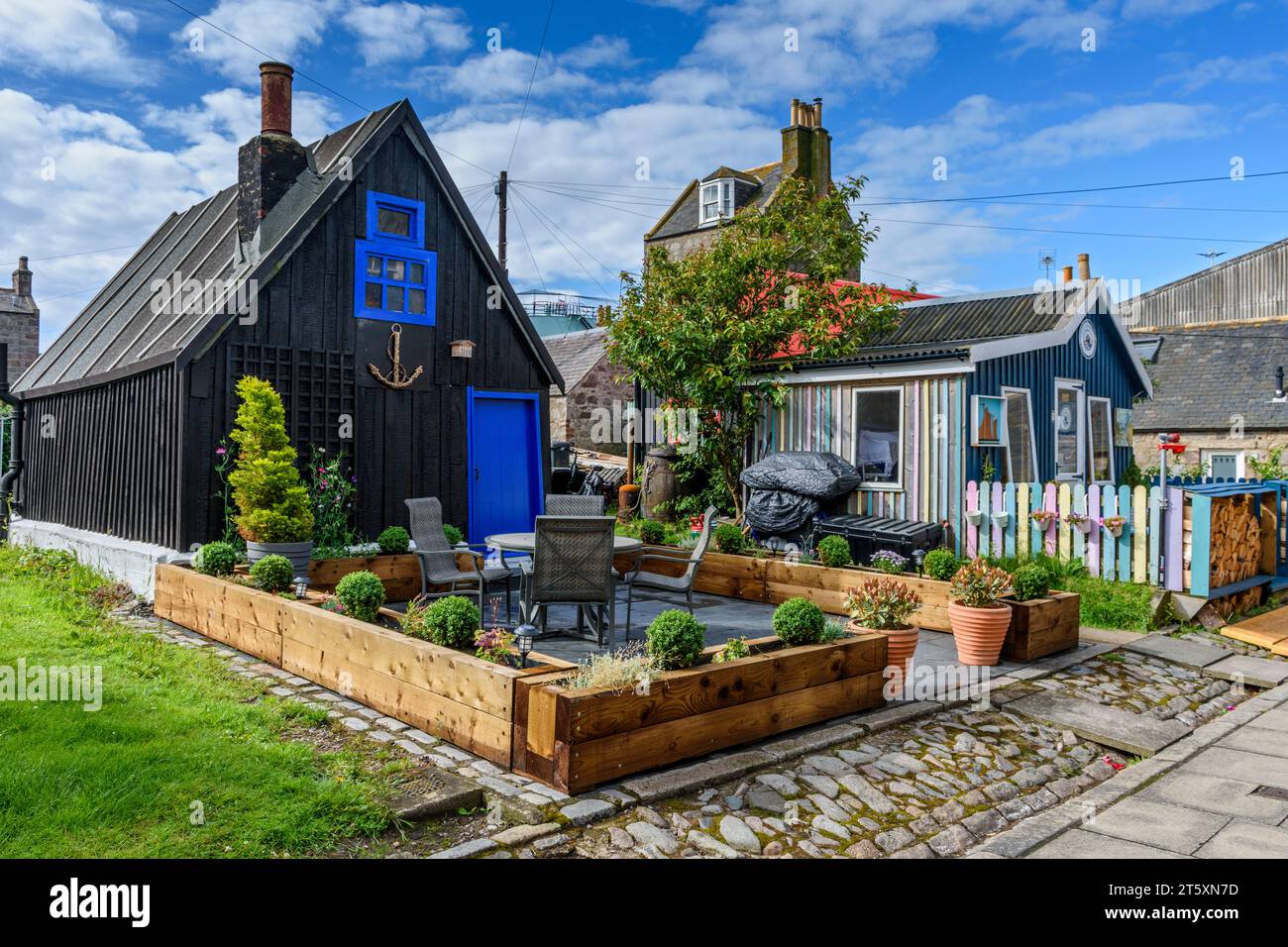Cottages in the historic former fishing village of Footdee, The dwellings are laid out in squares with their backs to the sea.  Aberdeen, Scotland, UK Stock Photo