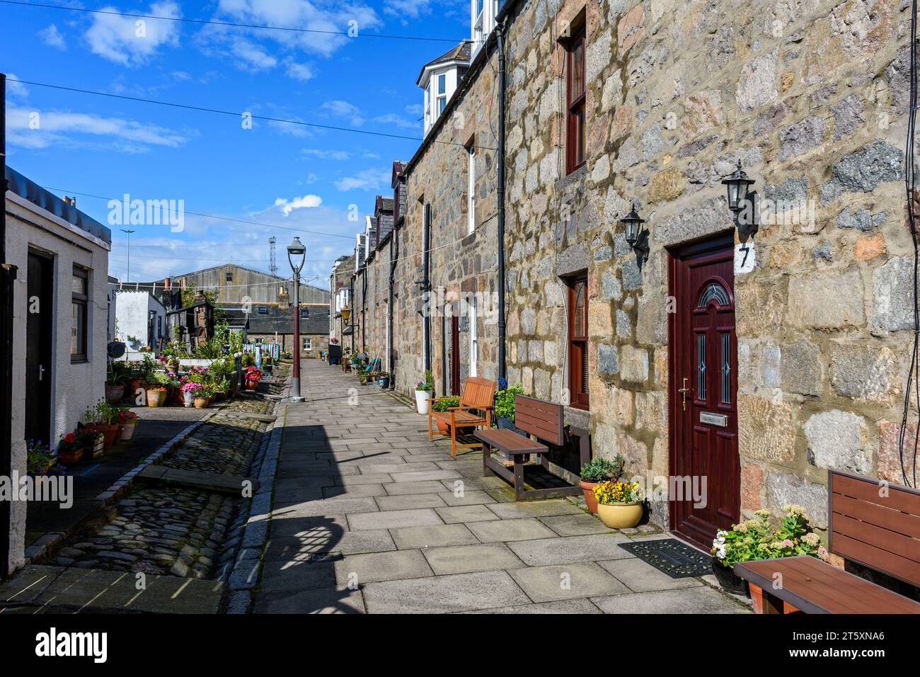 A street in the historic former fishing village of Footdee, The dwellings are laid out in squares with their backs to the sea.  Aberdeen, Scotland, UK Stock Photo