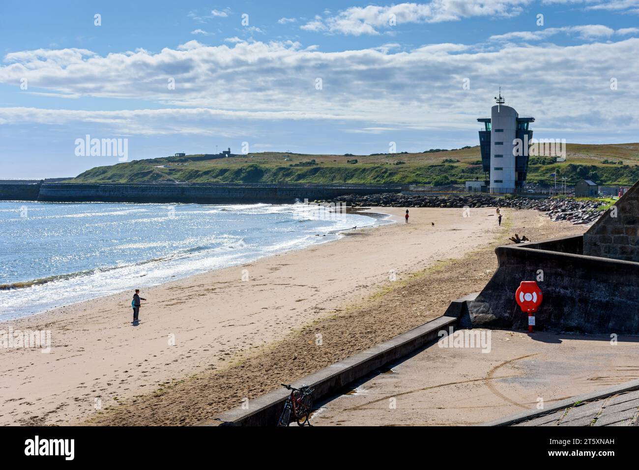 The beach, looking south from the historic village of Footdee towards the Marine Operations Centre at Pocra Quay, Aberdeen, Scotland, UK Stock Photo