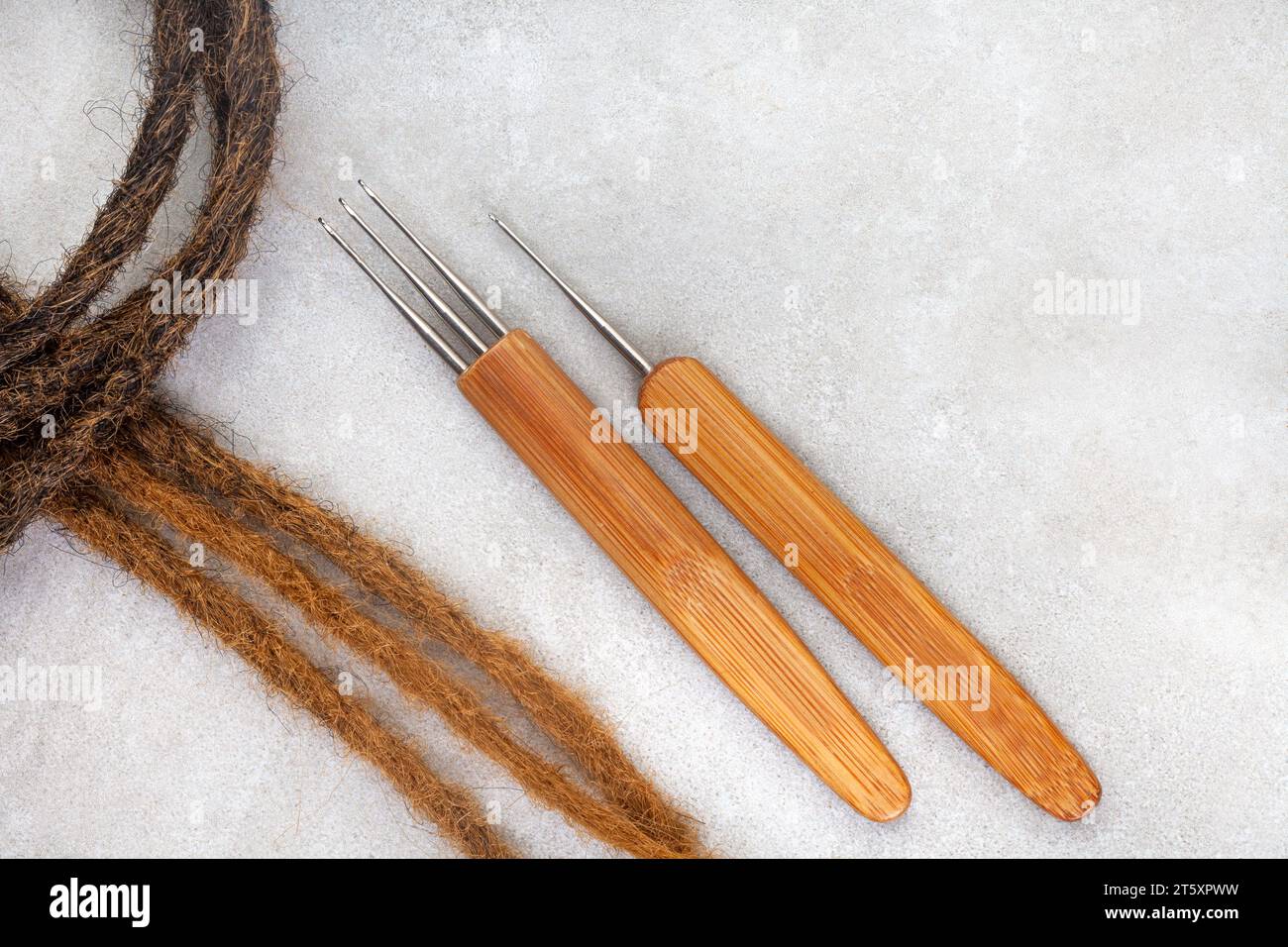 Hair crochet needles and decorative beads for dreadlocks and braids on white Stock Photo