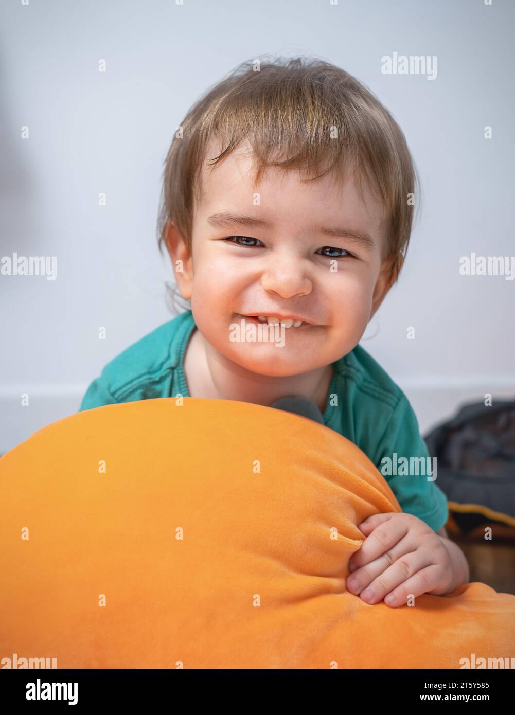 Portrait of a cute smiling boy child with a pillow Stock Photo